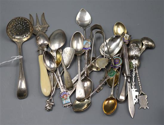 A Victorian silver beaded Old English pattern sifter spoon and a mixed group of silver and white metal flatware.